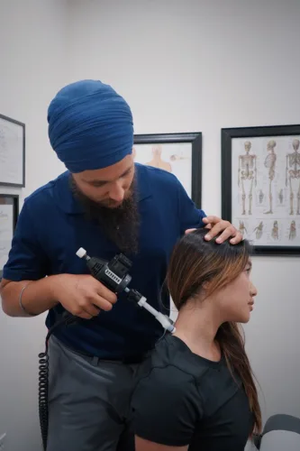 chiroprator treating womans neck