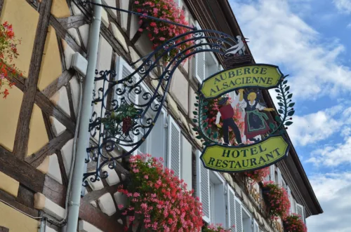 charming alsatian hotel sign in traditional village
