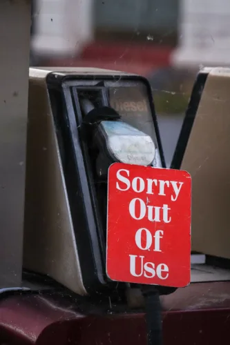 red signage on fuel pump