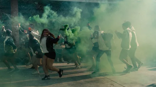 dynamic group party with colorful smoke